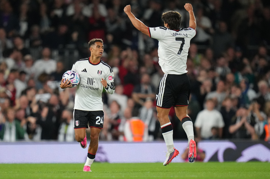 Fulham's Josh King and Gonzalo Garcia celebrate after scoring during the English Premier League soccer match between Fulham and Chelsea in London, Monday, Aug. 24, 2026. (AP Photo/Kirsty Wigglesworth)