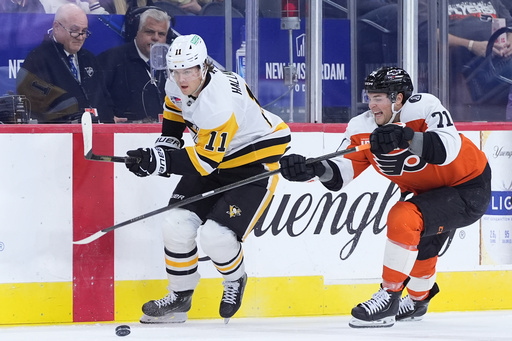 Pittsburgh Penguins' Filip Hallander, left, and Philadelphia Flyers' Tyson Foerster battle for the puck during the first period of an NHL hockey game, Tuesday, Oct. 28, 2025, in Philadelphia. (AP Photo/Matt Slocum) Pittsburgh Penguins' Filip Hallander, left, and Philadelphia Flyers' Tyson Foerster battle for the puck during the first period of an NHL hockey game, Tuesday, Oct. 28, 2025, in Philadelphia. (AP Photo/Matt Slocum)