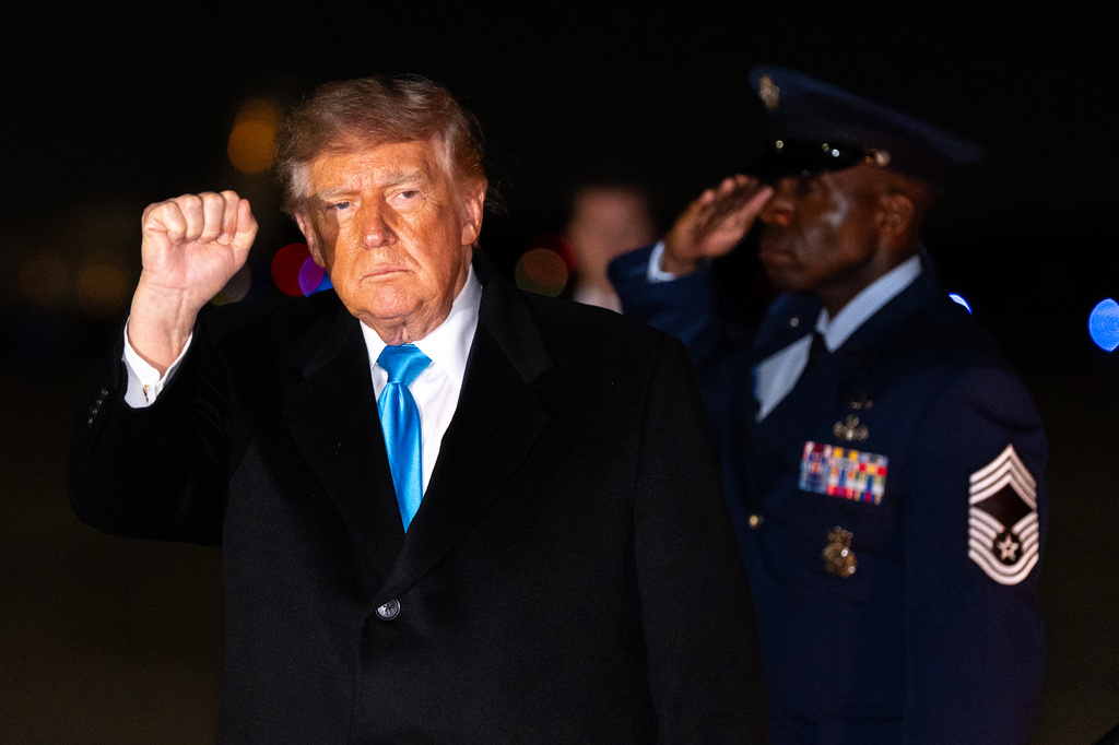 President Donald Trump pumps his fist as he arrives on Air Force One, Monday, Oct. 5, 2026, at Joint Base Andrews, Md. (AP Photo/Alex Brandon)