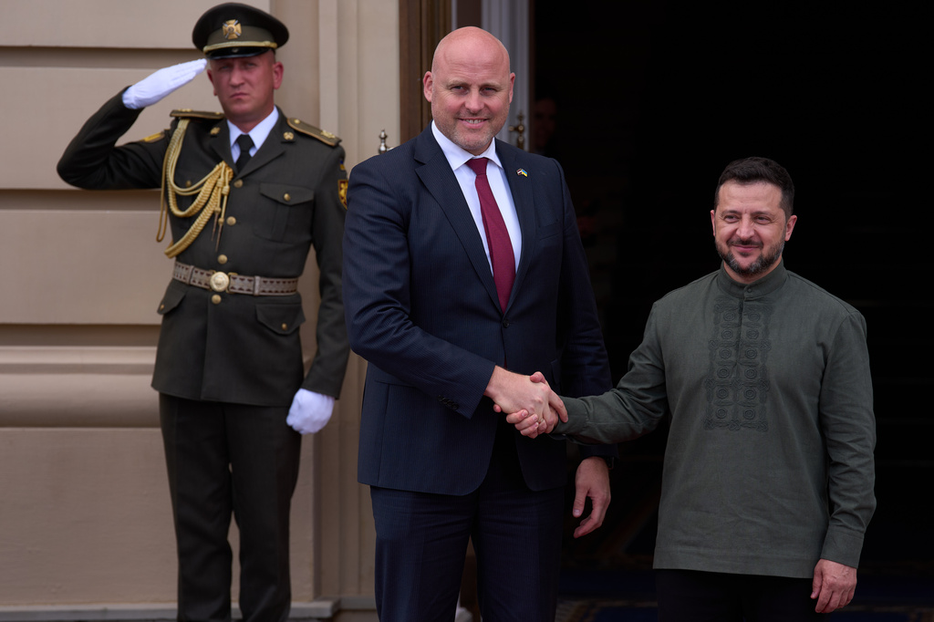 Latvia's Prime Minister Andris Kulberg, left, is welcomed by President Volodymyr Zelenskyy during a Ukrainian and Nordic-Baltic countries summit in Kyiv, Sunday, Aug. 23, 2026. (AP Photo/Francisco Seco)