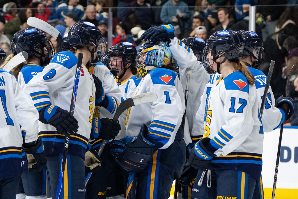 Toronto Sceptres' goaltender Raygan Kirk (1) celebrates with her teammates after defeating the Vancouver Goldeneyes during the third period of a PWHL hockey game in Vancouver, on Sunday, March 1, 2026. (Ethan Cairns/The Canadian Press via AP)