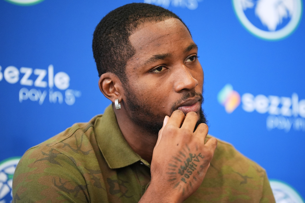 Minnesota Timberwolves forward Jonathan Kuminga listens to questions during an NBA basketball news conference at Target Center, Thursday, Sept. 10, 2026, in Minneapolis. (AP Photo/Ellen Schmidt)