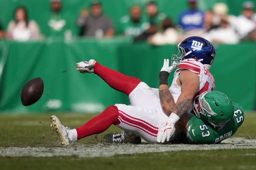 New York Giants running back Cam Skattebo (44) is injured near Philadelphia Eagles linebacker Zack Baun (53) during the first half of an NFL football game Sunday, Oct. 26, 2025, in Philadelphia. (AP Photo/Matt Slocum) New York Giants running back Cam Skattebo (44) is injured near Philadelphia Eagles linebacker Zack Baun (53) during the first half of an NFL football game Sunday, Oct. 26, 2025, in Philadelphia. (AP Photo/Matt Slocum)