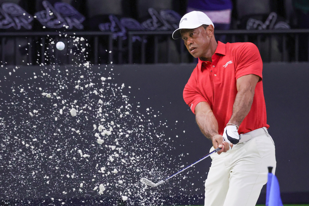 Tiger Woods hits a practice shot from a bunker before the TGL finals golf tournament in Palm Beach Gardens, Fla., Tuesday, March 24, 2026. (AP Photo/Reinhold Matay)