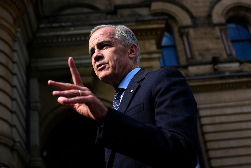 Canadian Prime Minister Mark Carney speaks with members of the media as he arrives at the Office of the Prime Minister and Privy Council in Ottawa, on Tuesday, Sept. 1, 2026. (Justin Tang/The Canadian Press via AP)