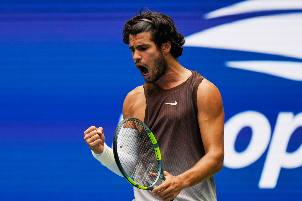 Carlos Alcaraz, of Spain, reacts during a match against Roman Safiullin, of Russia, during the first round of the U.S. Open tennis championships, Monday, Aug. 31, 2026, in New York. (AP Photo/Seth Wenig)
