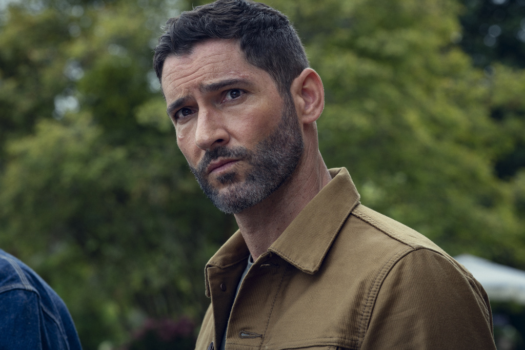 This image released by Netflix shows Tom Ellis in a scene from "The Thursday Murder Club." (Netflix via AP)