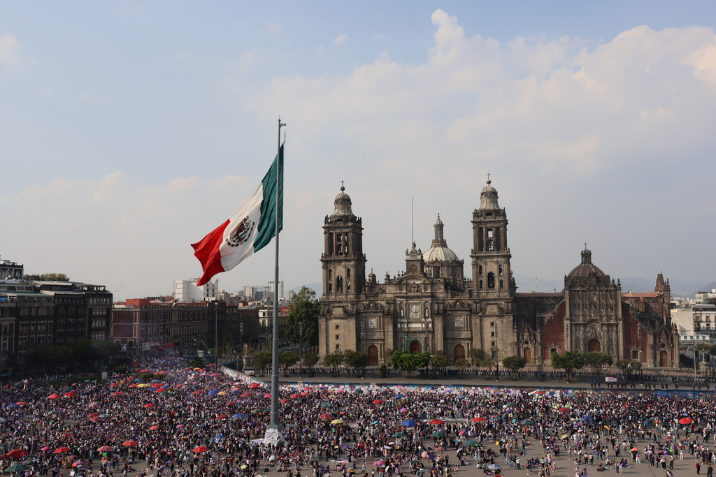 Protesters take part in a rally marking International Women's Day, at the Zocalo in Mexico City, Sunday, March 8, 2026. (AP Photo/Ginnette Riquelme)