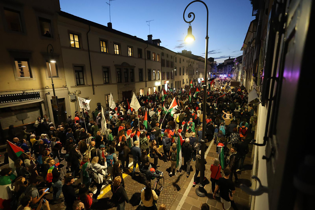 People take part in a pro-Palestinians protest ahead of the 2026 World Cup soccer match between Italy and Israel, in Udine, Italy, Tuesday, Oct. 14, 2025. (Riccardo Modena/LaPresse via AP)