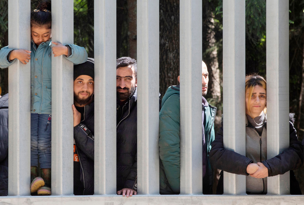 FILE - Members of a group of some 30 migrants seeking asylum are seen in Bialowieza, Poland, on May 28, 2023.. (AP Photo/Agnieszka Sadowska, File)
