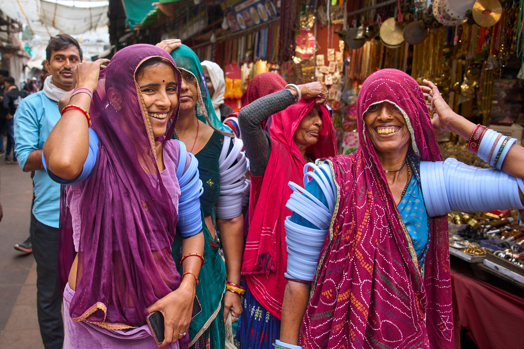 Women shop at a market near the annual cattle fair in Pushkar, in the western Indian state of Rajasthan, Monday, Oct. 27, 2025. (AP Photo/Rajesh Kumar Singh)