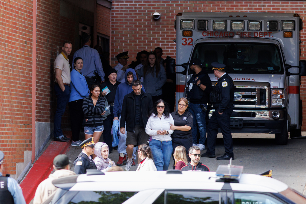 People walk outside of Illinois Masonic Hospital Advance Care in Lake View after a shooting Saturday, April 25, 2026, in Chicago. (Anthony Vazquez/Chicago Sun-Times via AP)