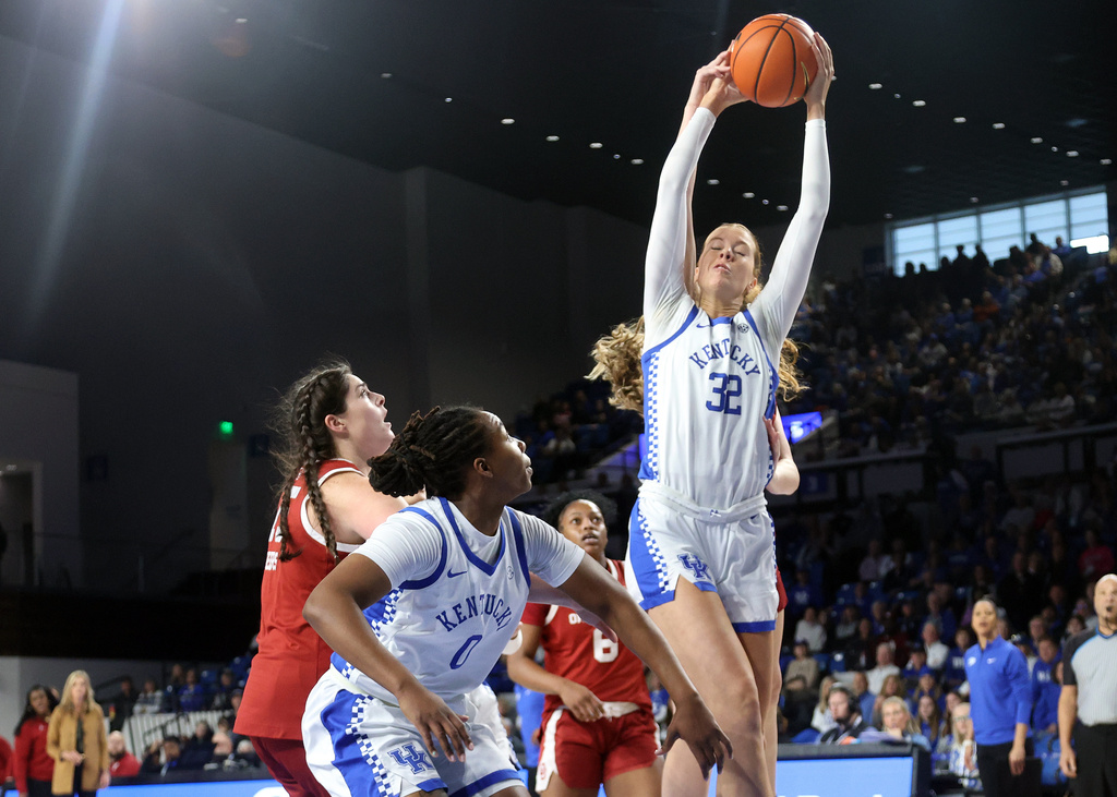 Kentucky's Amelia Hassett (32) pulls down a rebound during the first quarter of an NCAA college basketball game against Oklahoma in Lexington, Ky., Sunday, Jan. 11, 2026. (AP Photo/James Crisp)