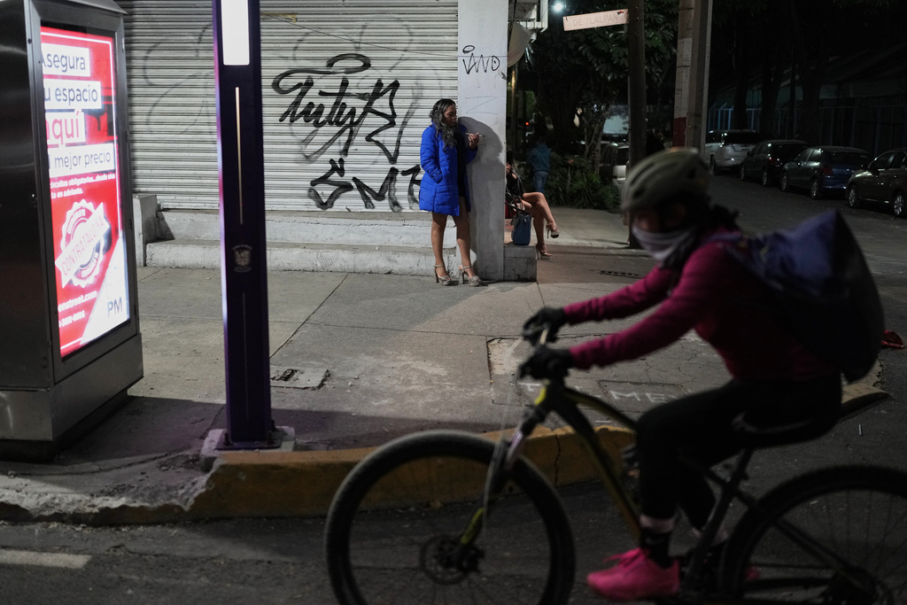 Montserrat Fuentes stands on Calzada de Tlalpan where she has worked as a sex worker for 20 years and the city is building a new bike lane ahead of the World Cup soccer tournament, blocking cars from pulling over and closing the metro at night, in Mexico City, Friday, Jan. 30, 2026. (AP Photo/Eduardo Verdugo)