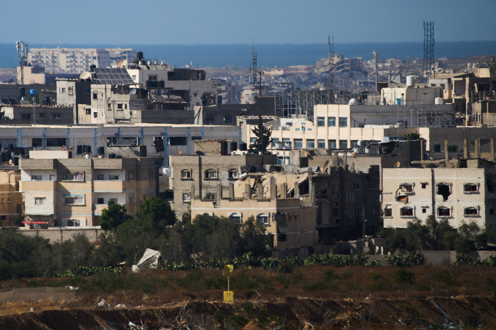 A yellow block noting part of the so-called yellow line that has separated the Gaza Strip's Israeli-held and Palestinian zones since the October ceasefire is visible in the central Gaza Strip, Tuesday, May 26, 2026. (AP Photo/Ariel Schalit)