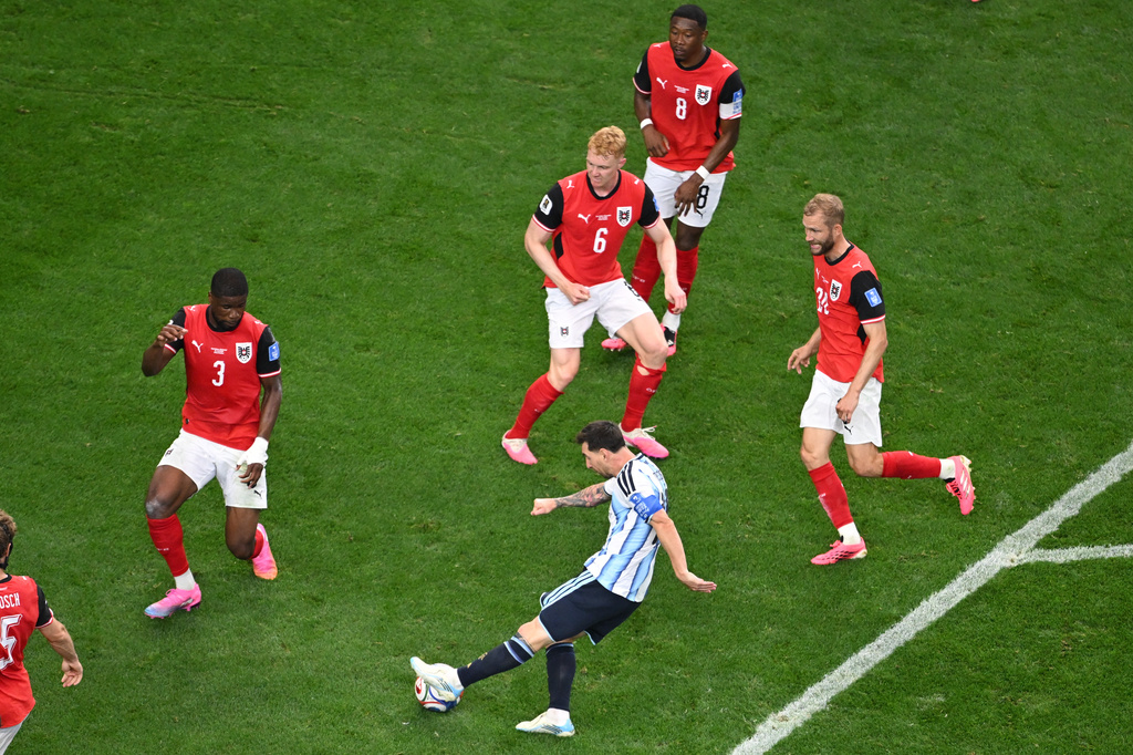 Argentina's Lionel Messi, bottom, attempts a shot on goal during the World Cup Group J soccer match between Argentina and Austria in Arlington, Texas, near Dallas, Monday, June 22, 2026. (AP Photo/Jessica Tobias)