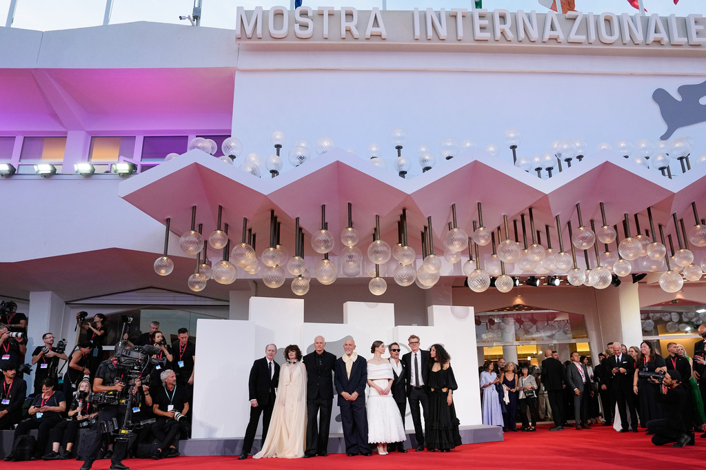 Steve Buscemi, from left, Parker Posey, director Martin McDonagh, John Malkovich, Mariana di Girolamo, Sam Rockwell, producer Graham Broadbent and Ailín Salas pose for photographers at the red carpet for the film 'Wild Horse Nine' during the 83rd edition of the Venice Film Festival in Venice, Italy, on Thursday, Sept. 3, 2026. (Photo by Alessandra Tarantino/Invision/AP)