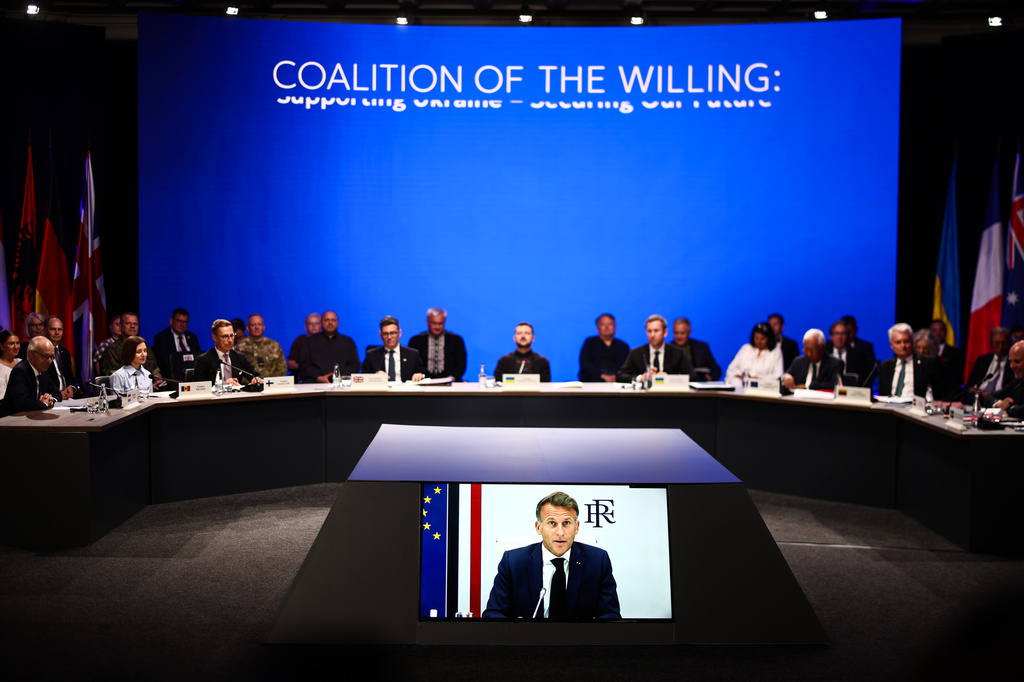 From left, Luxembourg's Prime Minister Luc Frieden, Moldova's President Maia Sandu, Finland's President Alexander Stubb, Britain's Prime Minister Andy Burnham, Ukraine's President Volodymyr Zelenskyy, Ukraine's Prime Minister Sergiy Koretsky, EU Council President Antonio Costa, Lithuania's President Gitanas Nauseda listen to France's President's Emmanuel Macron speaking via video conference during the Coalition of the Willing meeting, in Kyiv, Ukraine, Monday, Aug. 24, 2026. (Henry Nicholls/Pool photo via AP)