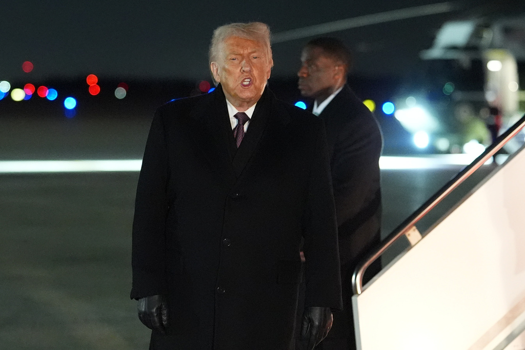 President Donald Trump arrives at Joint Base Andrews, Md., after attending the World Economic Forum in Davos, Thursday, Jan. 22, 2026. (AP Photo/Evan Vucci)