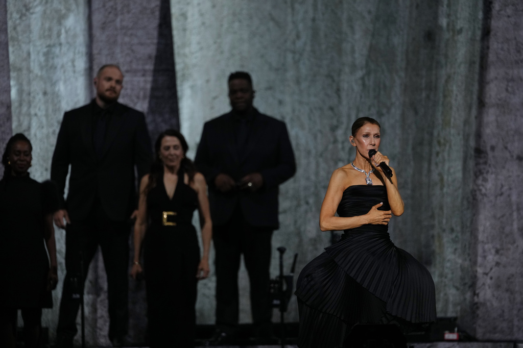 Singer Celine Dion performs during the opening concert of her "Celine Dion Paris 2026" residency at the Plenitude Arena in Nanterre, France, outside Paris, Saturday, Sept. 12, 2026. (AP Photo/Aurelien Morissard)