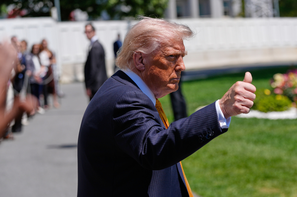 President Donald Trump gives a thumbs up as he leaves the White House for travel to Beijing, Tuesday, May 12, 2026, in Washington, to meet with China's President Xi Jinping. (AP Photo/Manuel Balce Ceneta)