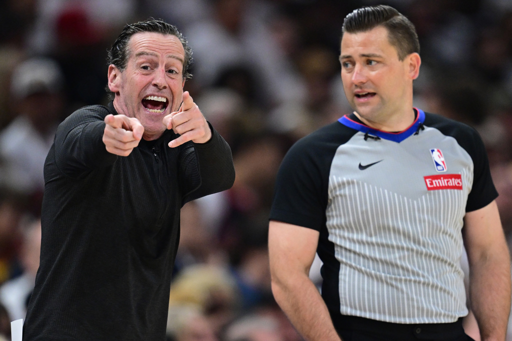Cleveland Cavaliers head coach Kenny Atkinson, left, disputes a call with referee Gediminas Petraitis during the second half in Game 5 of a first-round NBA playoffs basketball series against the Toronto Raptors, Wednesday, April 29, 2026, In Cleveland. (AP Photo/David Dermer)