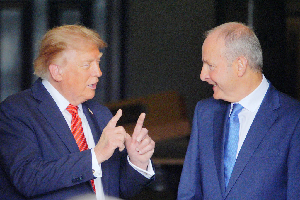 U.S. President Donald Trump speaks with Irish Prime Minister Micheal Martin, right, as he leaves Farmleigh House, in Dublin, Saturday, Sept. 12, 2026.(Ben Birchall/PA via AP)