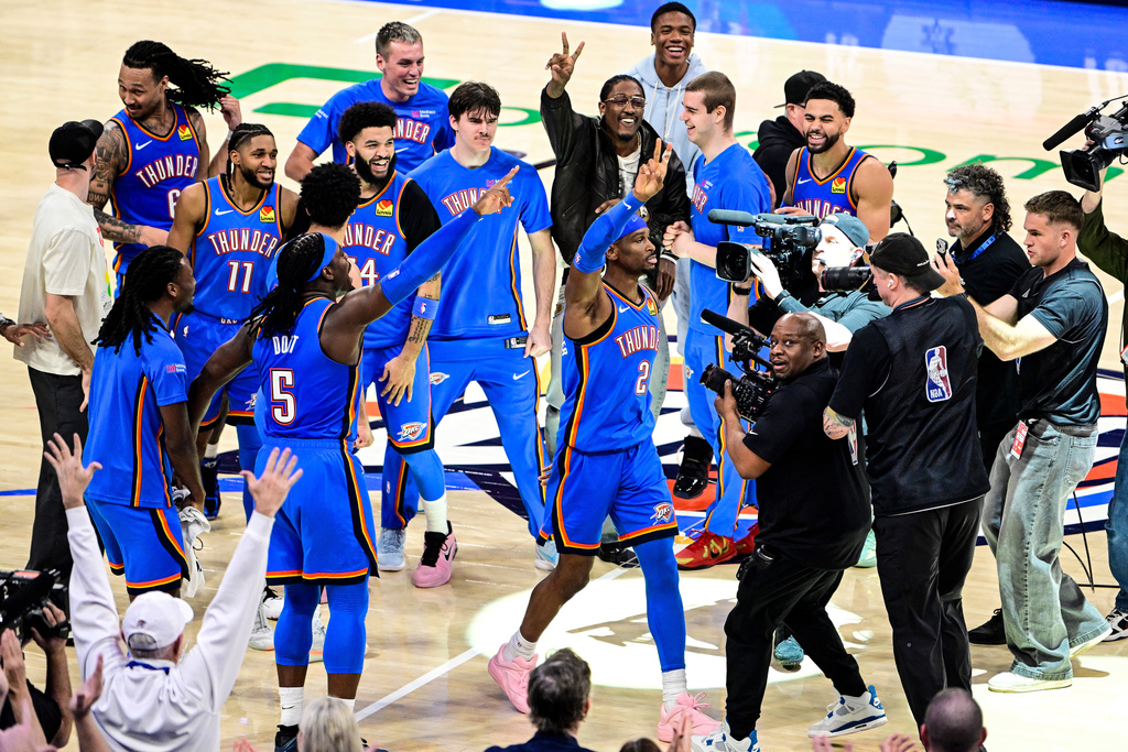 Oklahoma City Thunder guard Shai Gilgeous-Alexander (2) celebrates with teammates after the second half of an NBA basketbal against the Denver Nuggetsl game Monday, March 9, 2026, in Oklahoma City. (AP Photo/Gerald Leong)