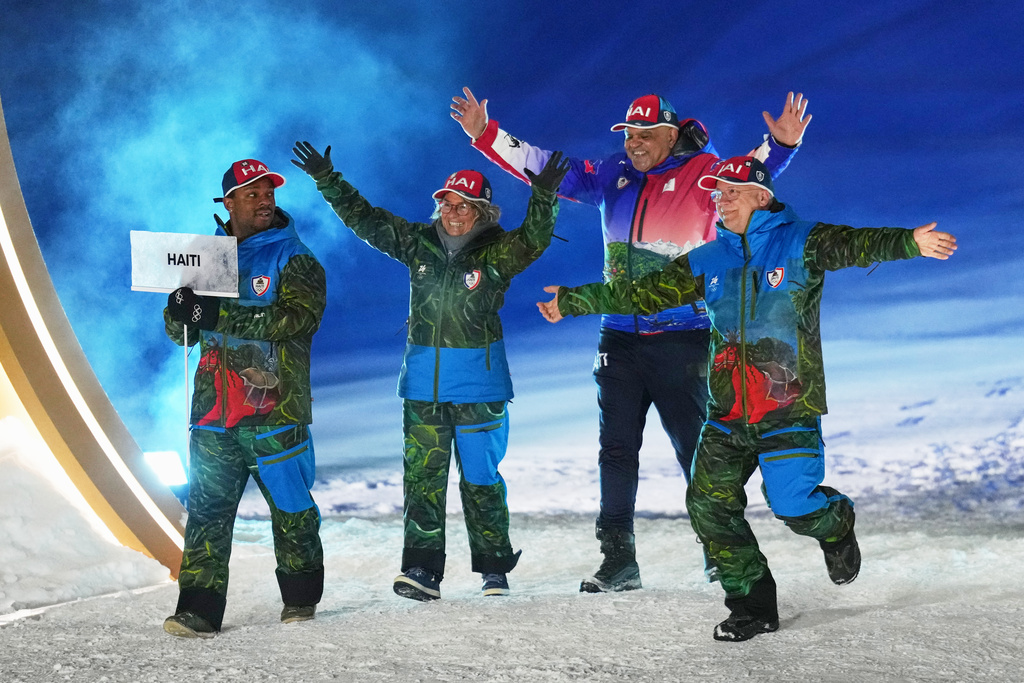Athletes from Haiti walk during the Olympic opening ceremony at the 2026 Winter Olympics, in Livigno, Italy, Friday, Feb. 6, 2026. (AP Photo/Abbie Parr)