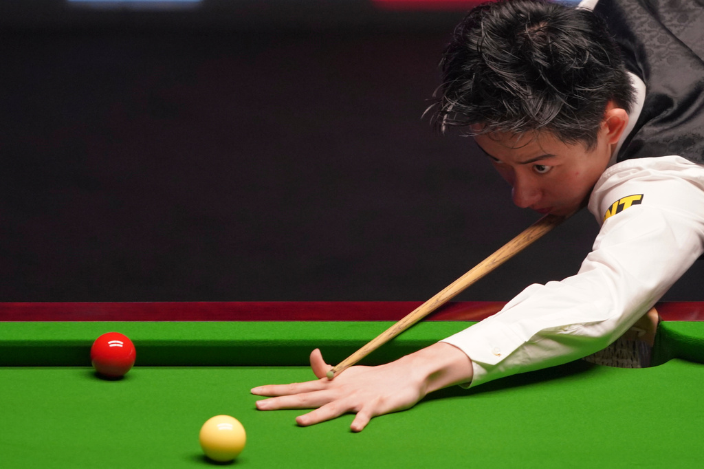 China's Wu Yize prepares to play during his match against England's Shaun Murphy at the World Snooker Championship in Sheffield, England, Monday, May 4, 2026.(AP Photo/Ian Hodgson)