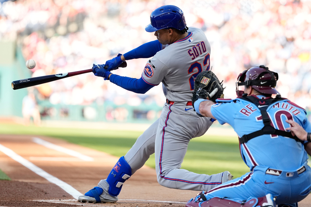 New York Mets' Juan Soto hits a home run against Philadelphia Phillies pitcher Aaron Nola during the first inning of a baseball game Thursday, June 18, 2026, in Philadelphia. (AP Photo/Matt Slocum)