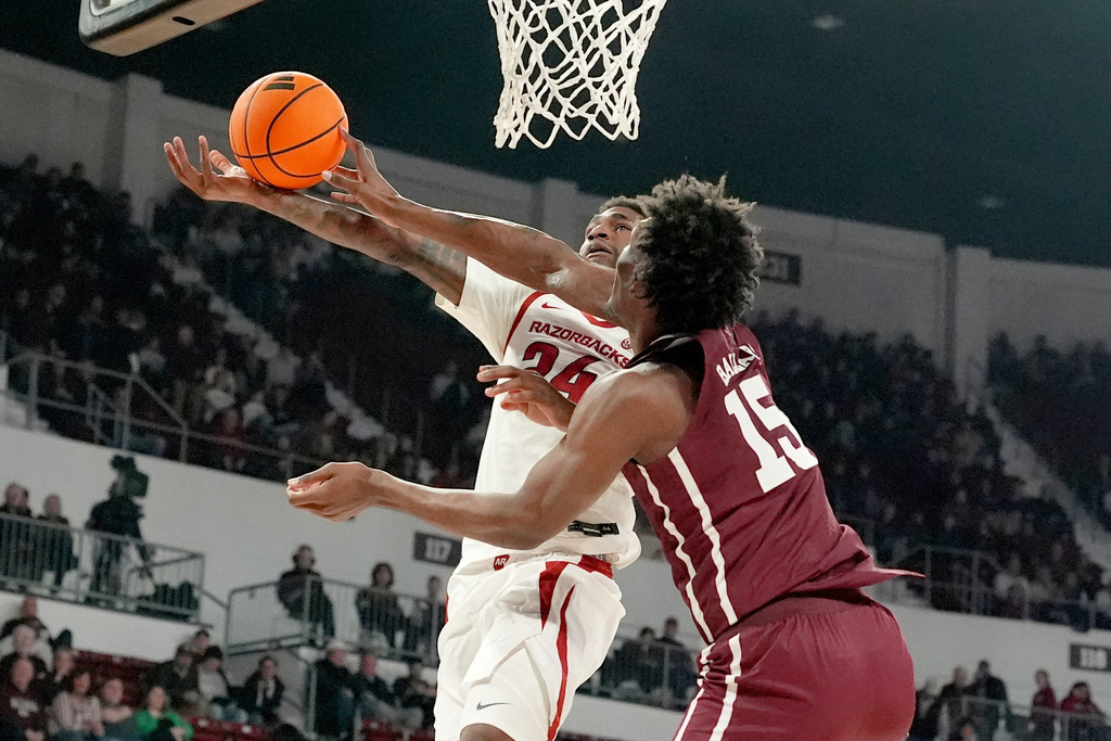 Mississippi State center Quincy Ballard (15) blocks a shot by Arkansas forward Billy Richmond III (24) during the first half of an NCAA college basketball game, Saturday, Feb. 7, 2026, in Starkville, Miss. (AP Photo/Rogelio V. Solis)