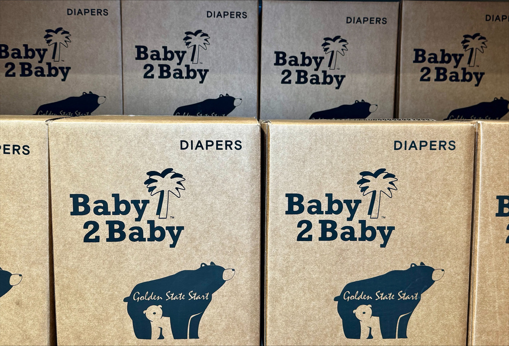 This photo provided by Baby2Baby shows stacks of packaged diapers Wednesday, May 7, 2026, at Baby2Baby's Los Angeles headquarters. (Baby2Baby via AP)