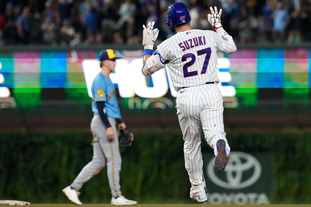 Chicago Cubs' Seiya Suzuki (27), of Japan, celebrates as he rounds the bases after hitting a solo home run during the fourth inning of a baseball game against the Milwaukee Brewers in Chicago, Monday, Aug. 31, 2026. (AP Photo/Nam Y. Huh)
