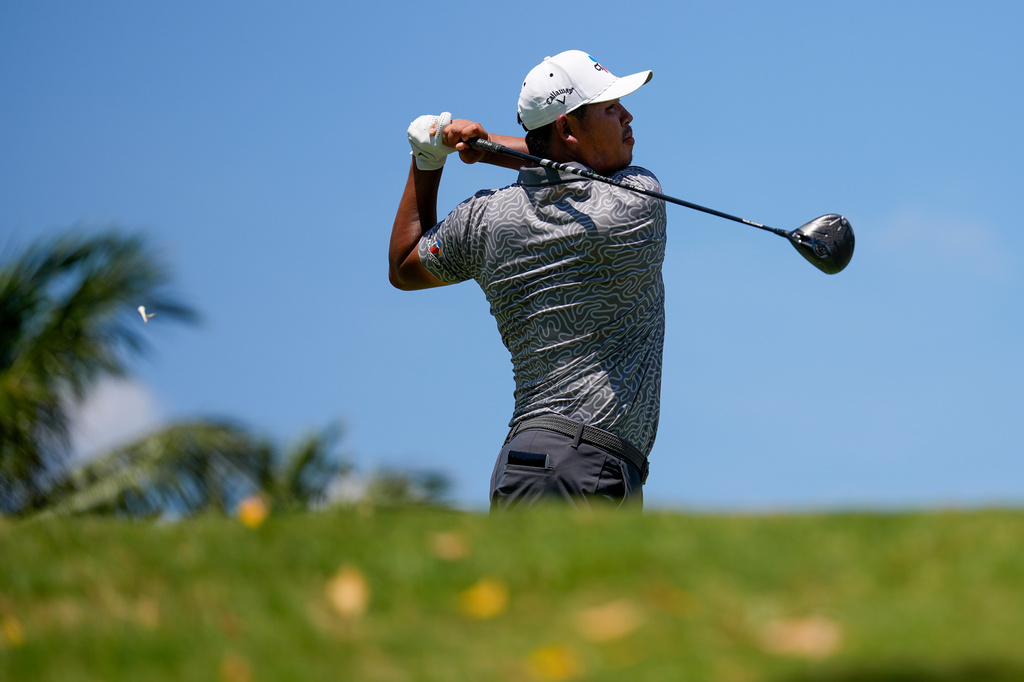 Si Woo Kim, of South Korea, hits from the eighth tee during the third round of the Cadillac Championship PGA golf tournament Saturday, May 2, 2026, in Doral, Fla. (AP Photo/David J. Phillip)