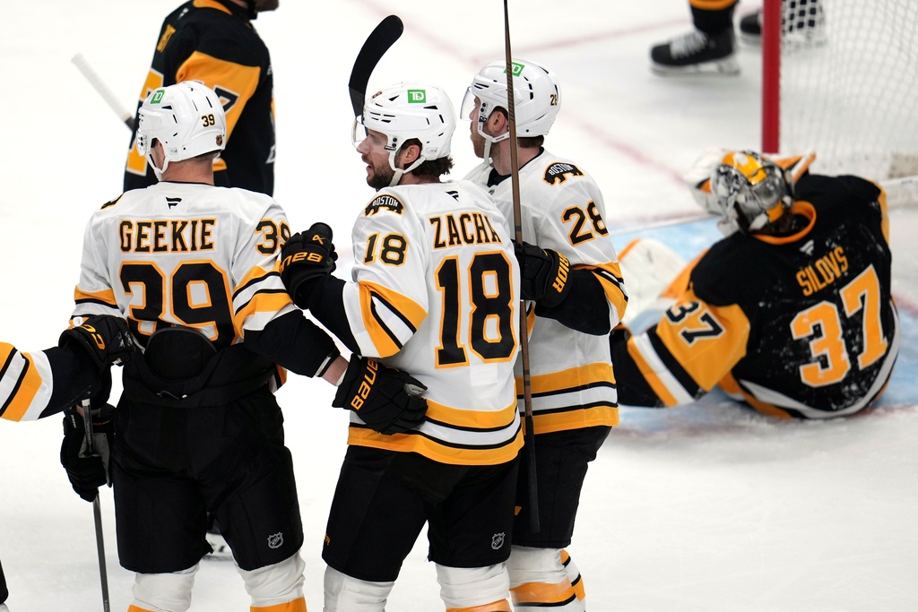 Boston Bruins' Pavel Zacha (18) celebrates his goal during the first period of an NHL hockey game against the Pittsburgh Penguins in Pittsburgh, Sunday, March 8, 2026. (AP Photo/Gene J. Puskar)