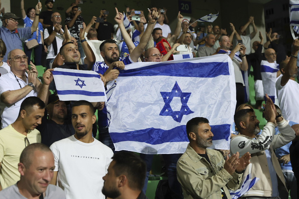 Israel's fans cheer during a group 1, World Cup qualifier soccer match between Moldova and Israel at the ZImbru stadium in Chisinau, Moldova, Friday, Sept. 5, 2025. (AP Photo/Aurel Obreja)