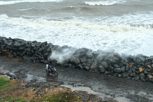 A motorist drives past boulders recently installed along the coastline to protect against high tides during Cyclone Montha, in Kakinada district of Andhra Pradesh, India, Tuesday, Oct. 28, 2025. (AP Photo) A motorist drives past boulders recently installed along the coastline to protect against high tides during Cyclone Montha, in Kakinada district of Andhra Pradesh, India, Tuesday, Oct. 28, 2025. (AP Photo)