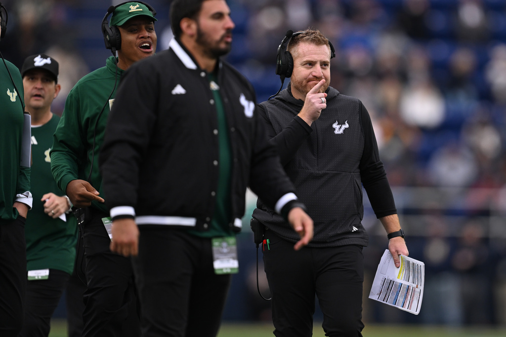 South Florida head coach Alex Golesh, right, reacts during the first half of an NCAA college football game against Navy, Saturday, Nov. 15, 2025, in Annapolis, Md. (AP Photo/Gail Burton)