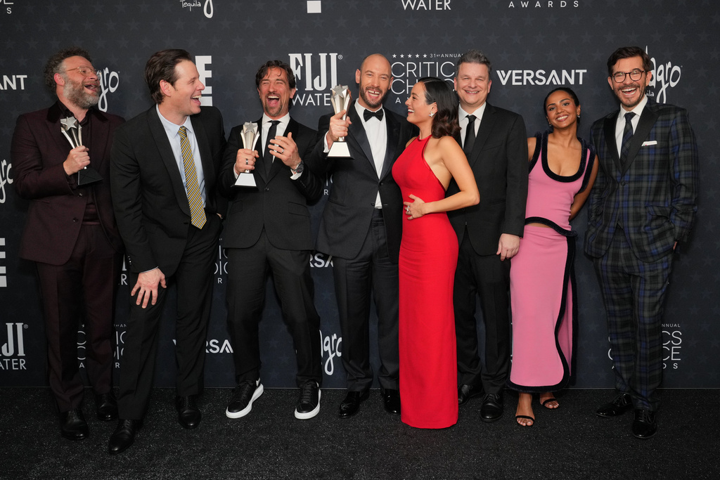 Seth Rogen, from left, winner of the award for best actor in a comedy series for "The Studio," Ike Barinholtz, winner of the award for best supporting actor in a comedy series for "The Studio," James Weaver, Evan Goldberg, Chase Sui Wonders, Alex Gregory, Frida Perez and Peter Huyck, pose with the award for best comedy series for "The Studio" in the press room during the 31st Annual Critics Choice Awards on Sunday, Jan. 4, 2026, at The Barker Hanger in Santa Monica, Calif. (Photo by Jordan Strauss/Invision/AP)