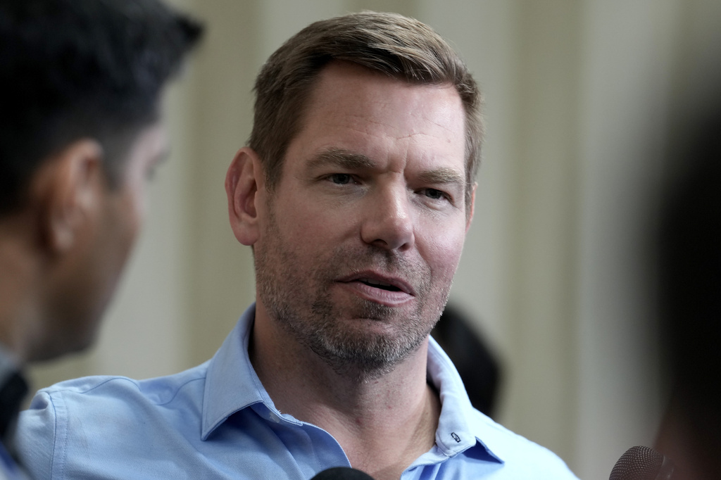 FILE - California gubernatorial candidate Rep. Eric Swalwell, D-Calif., talks with reporters after holding a town hall meeting in Sacramento, Calif., April 7, 2026. (AP Photo/Rich Pedroncelli, File)