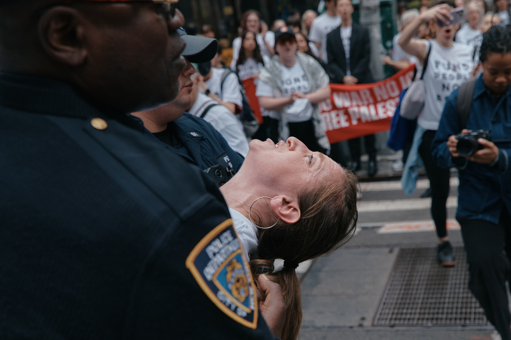 A protester with Jewish Voice for Peace is arrested after blocking traffic during a demonstration outside the New York office of U.S. Sen. Chuck Schumer, calling for an end to the U.S.-Israel war with Iran and opposing U.S. weapons support on Monday, April 13, 2026, in New York. (AP Photo/Andres Kudacki)