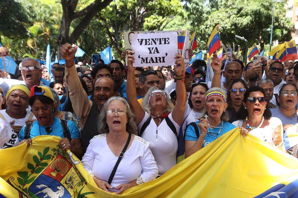 Supporters of opposition leader María Corina Machado mark the second anniversary of the disputed 2024 presidential election in Caracas, Venezuela, Tuesday, July 28, 2026. (AP Photo/Pedro Mattey)