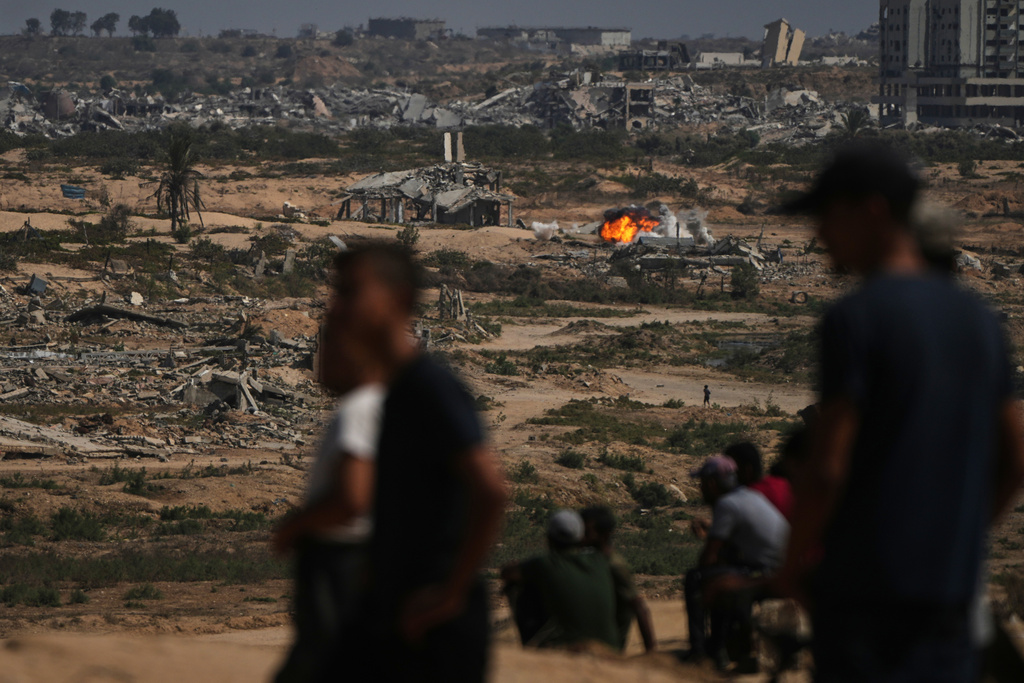 Fire and smoke rises following an Israeli army shelling in Nuseirat, central Gaza Strip, Saturday, Oct. 4, 2025.(AP Photo/Abdel Kareem Hana)