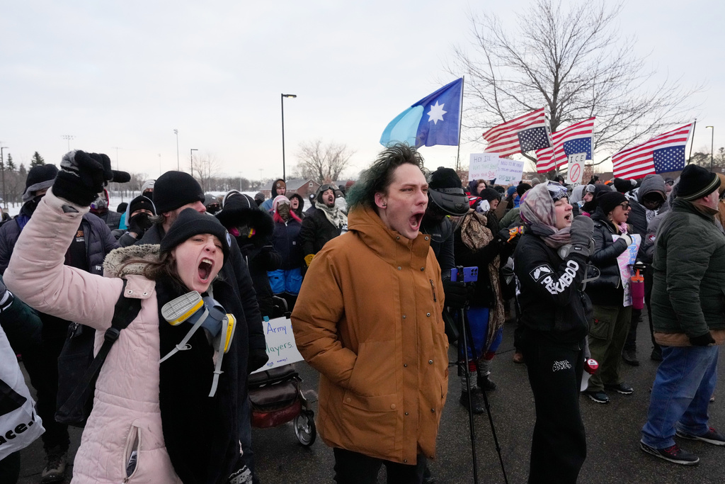 Protesters shout at federal law enforcement outside the Bishop Henry Whipple Federal Building on Saturday, Jan. 17, 2026, in Minneapolis. (AP Photo/Yuki Iwamura)