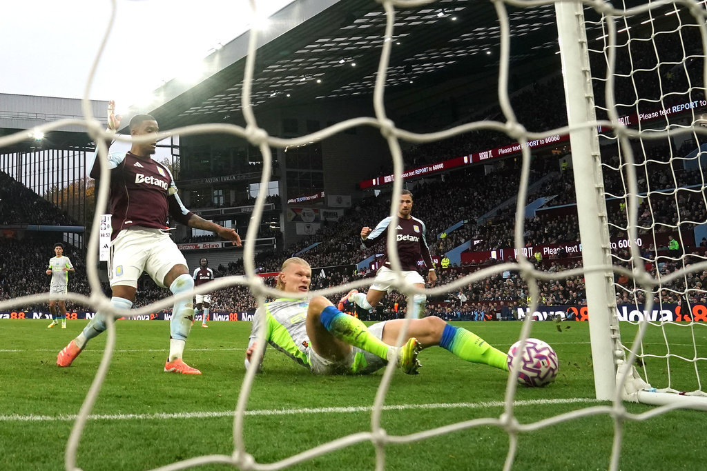 Manchester City's Erling Haaland scores a goal before being ruled out for offside via VAR during the English Premier League match between Aston Villa and Manchester City, in Birmingham, England, Sunday Oct. 26, 2025. (Nick Potts/PA via AP)