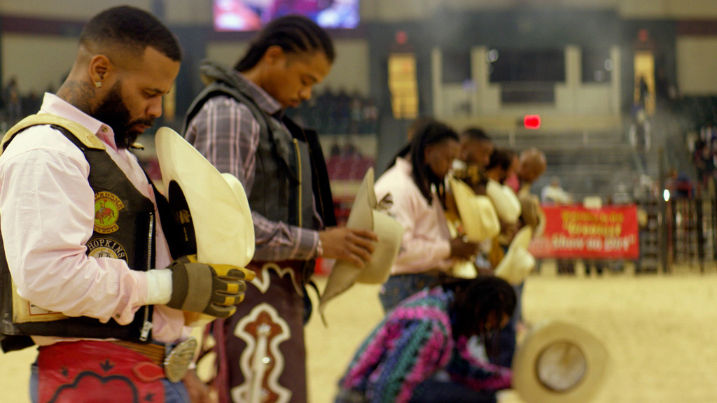 This image released by Peacock shows Damon Hopkins, left, in a scene from the documentary "High Horse: The Black Cowboy." (Troy Harvey/Peacock via AP)