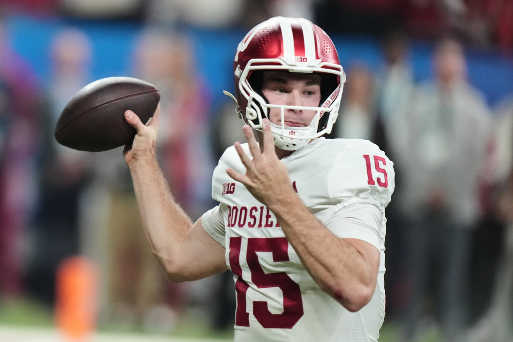 FILE - Indiana's Fernando Mendoza throws during the first half of the Big Ten championship NCAA college football game against Ohio State in Indianapolis, Saturday, Dec. 6, 2025. (AP Photo/AJ Mast, File)