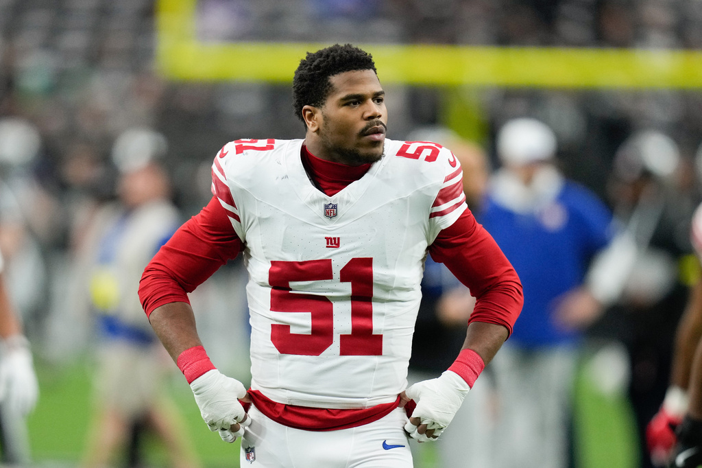 FILE - New York Giants linebacker Abdul Carter (51) walks on the field before the team's NFL football game against the Las Vegas Raiders on Dec. 28, 2025, in Las Vegas. (AP Photo/John Locher, File)