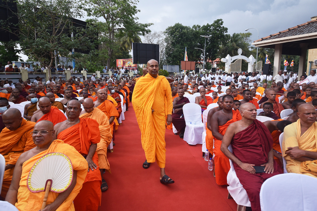 Buddhist monks gather to stage a protest demanding more respect from the government, in Colombo, Sri Lanka, Friday, Feb. 20, 2026. (AP Photo/Venura C. Rathnayake)
